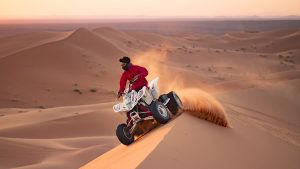 Quad in high speed at erg chebbi dunes sahara desert photo © Ezyê Moleda all rights reserved